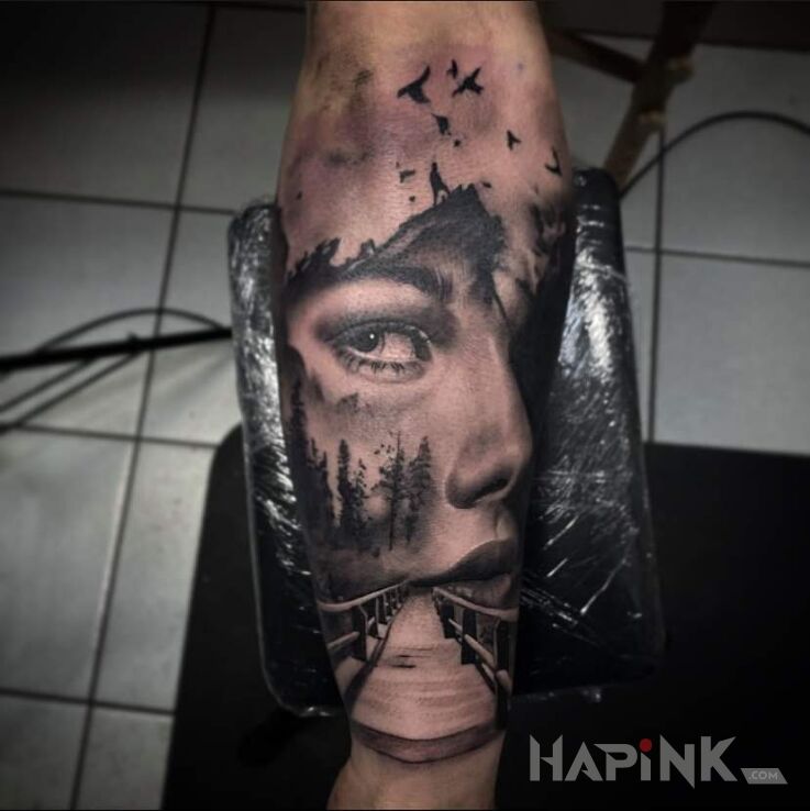 Tattoo Druga strona in faces motif and realistic style on the forearm