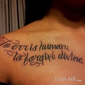 Tattoo A hard-to-read tattoo on the chest motif: lettering