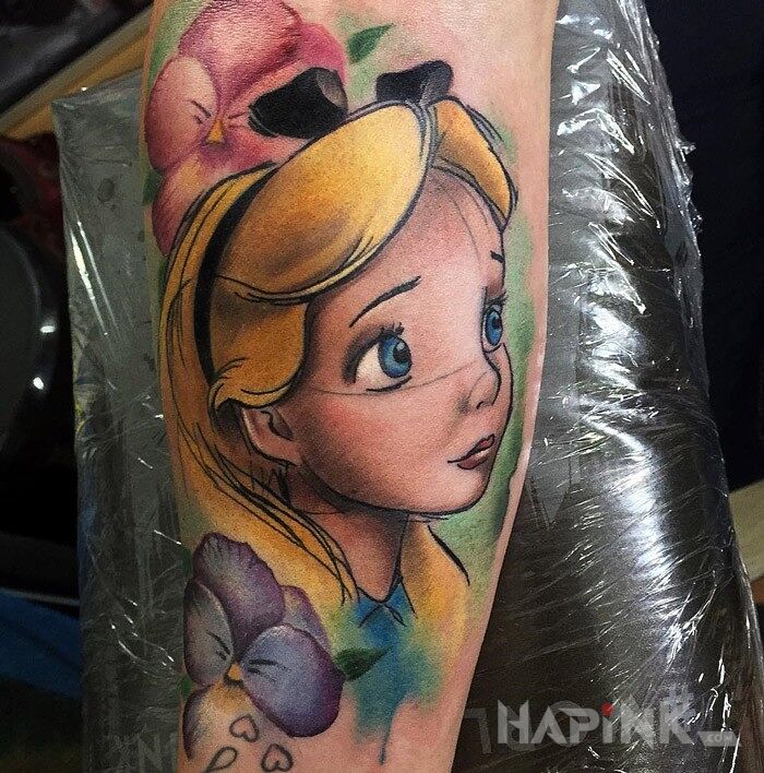 Tattoo Alicja w krainie czarów in characters motif on the forearm