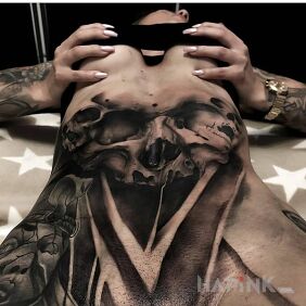Tattoo Skulls on the lower back on the stomach motif: skulls style: realistic