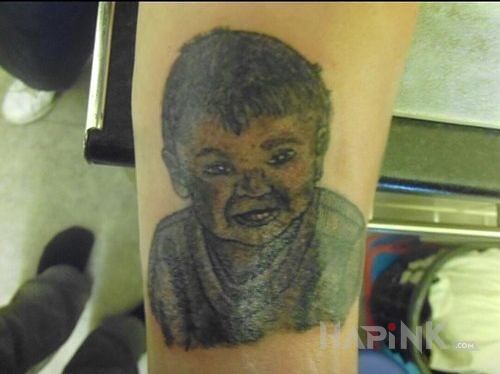 Tattoo Chyba coś nie wyszło in faces motif on the forearm