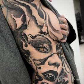 Tattoo Vampiress on the ribs motif: demons style: realistic