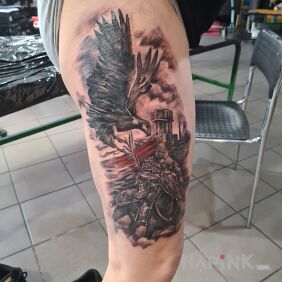 Tattoo Hussaria Silesia on the thigh motif: animals style: realistic