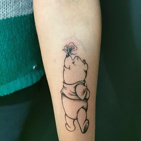 Tattoo Winnie the Pooh On the arm motif: characters style: cartoon / comic book