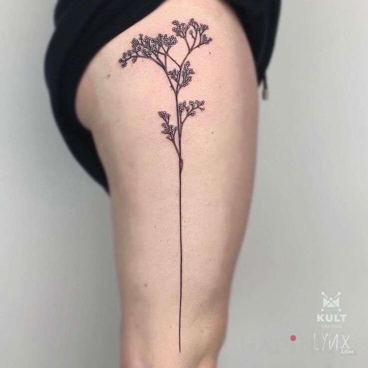Tattoo ŁODYGA in black and gray motif and realistic style on the leg