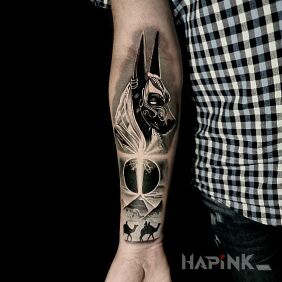 Tattoo Anubis On the arm motif: black and gray style: realistic