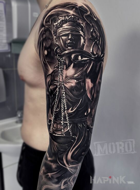 Tattoo Temida in black and gray motif and realistic style on the upper arm