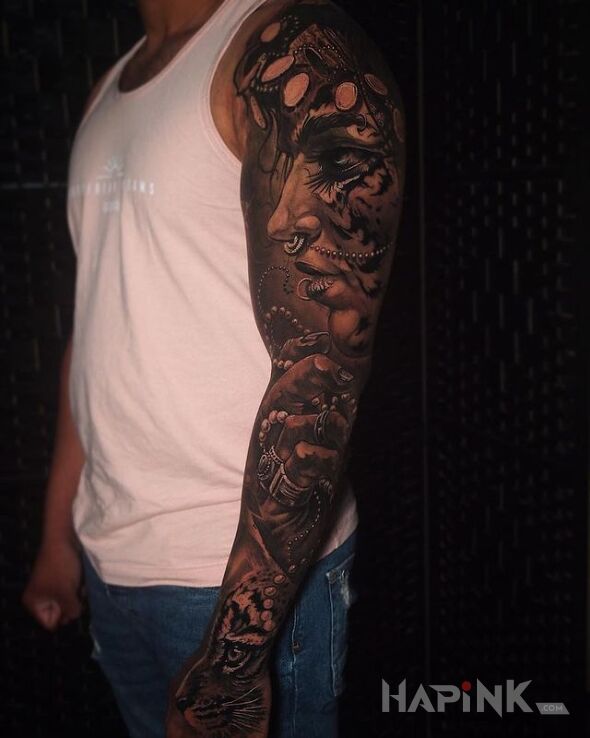 Tattoo Kobieca twarz in sleeves motif and realistic style on the upper arm