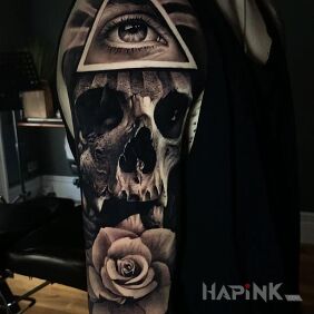 Tattoo Eye in a triangle on the upper arm motif: dark style: realistic