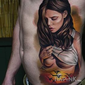 Tattoo Girl on the ribs on the stomach motif: colorful style: realistic