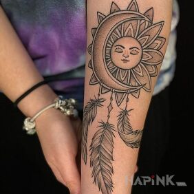 Tattoo The moon cuddling with the sun on the forearm motif: other style: graphic / illustrative