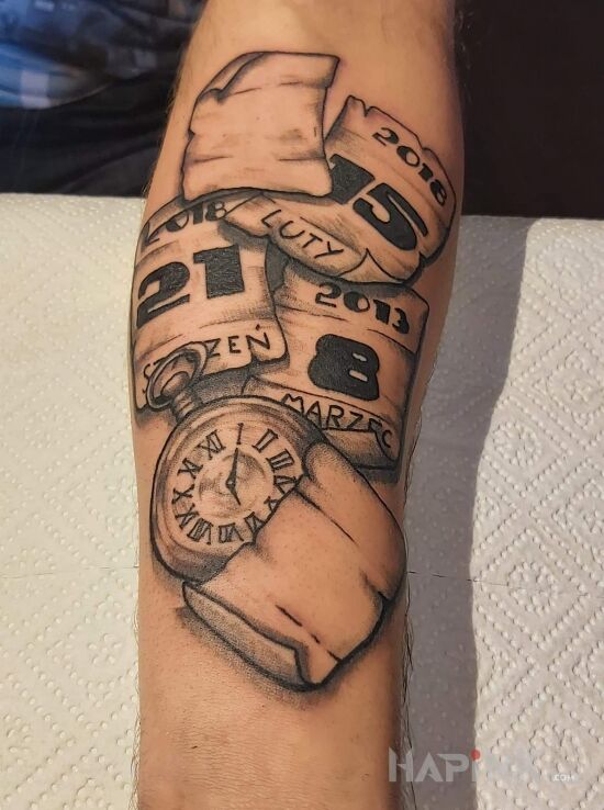 Tattoo Ku Pamieci... in lettering motif and realistic style on the forearm