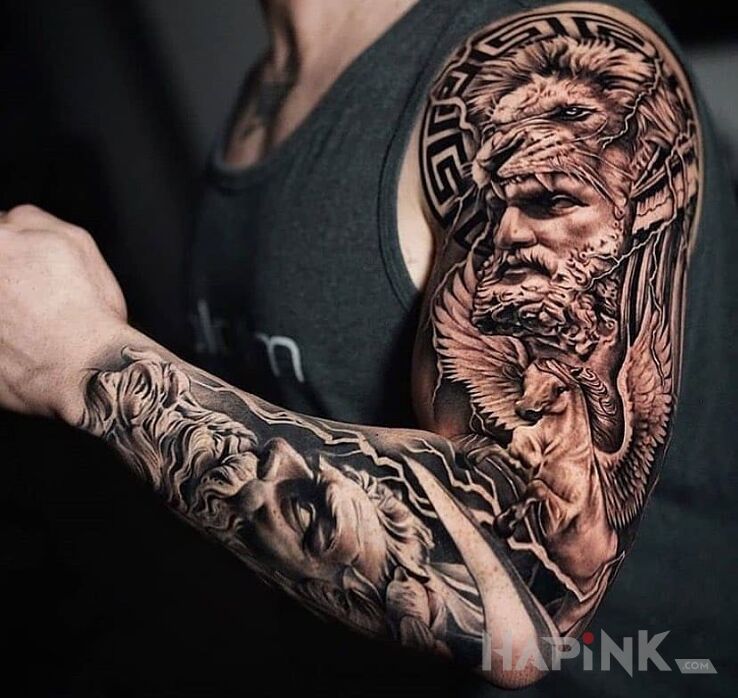 Tattoo Herkules w skórze lwa in black and gray motif and realistic style On the arm
