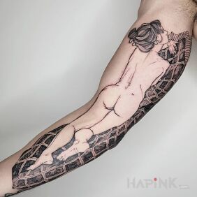 Tattoo Woman on a blanket On the arm motif: black and gray style: graphic / illustrative