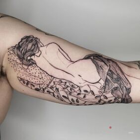 Tattoo Girl under the blanket on the bicep motif: black and gray style: graphic / illustrative