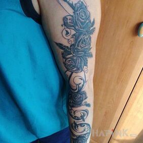 Tattoo My own design on the upper arm motif: flowers