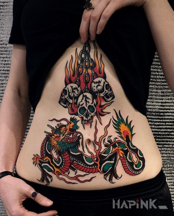Tattoo Retro smok in colorful motif and oldschool style on the stomach