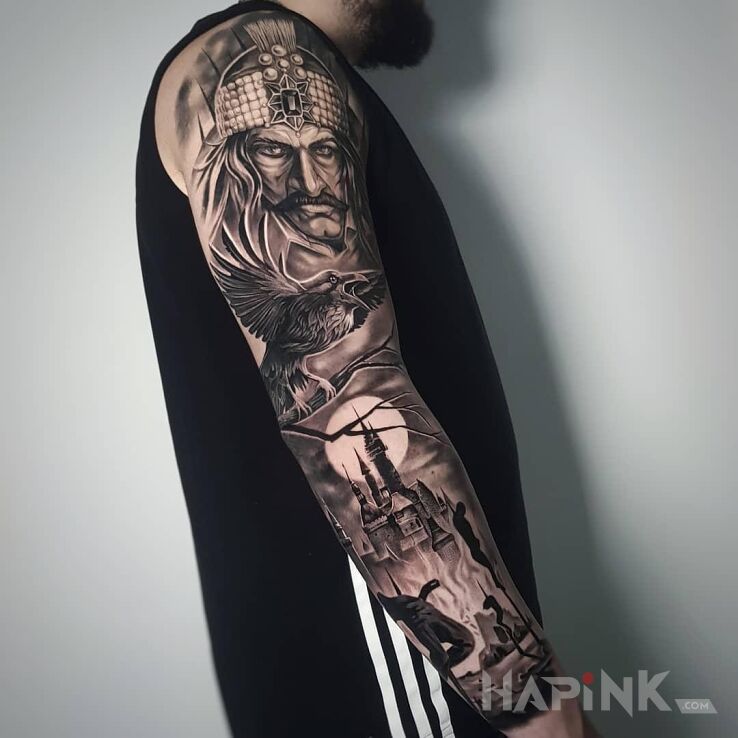 Tattoo Vlad Palownik ? in dark motif and realistic style on the upper arm