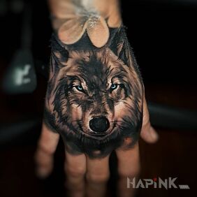 Tattoo Blue-eyed wolf on the hand motif: animals