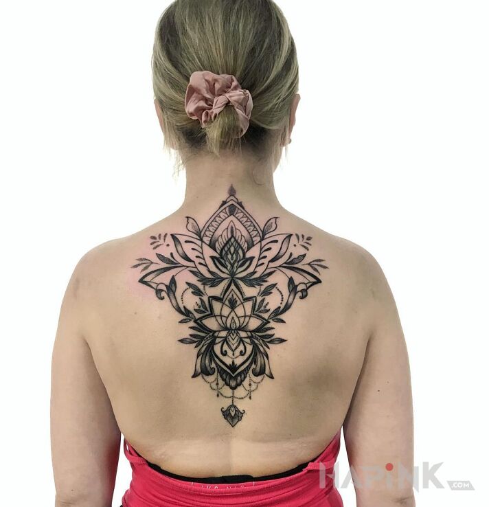 Tattoo Ornament in black and gray motif and blackwork / blackout style on the back