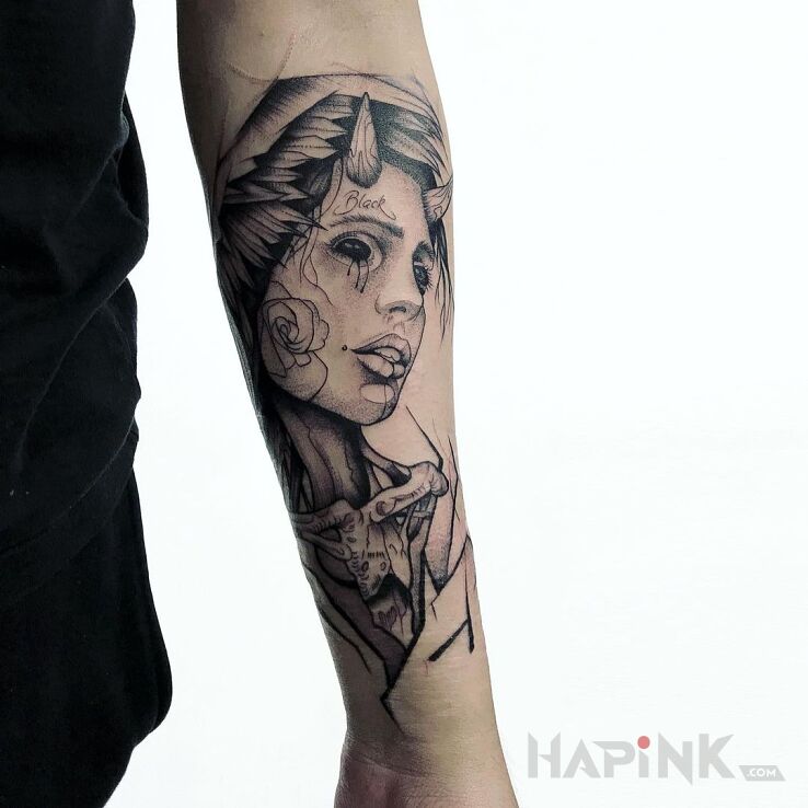 Tattoo Kobieta - demon in dark motif and graphic / illustrative style on the forearm