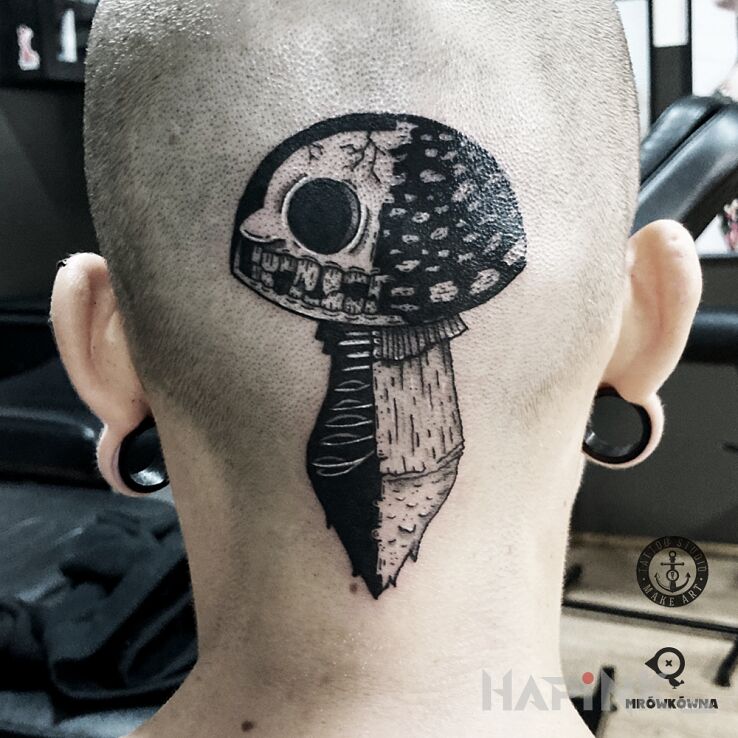 Tattoo Grzybek in black and gray motif and surrealistic style on the head