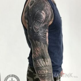 Tattoo Sleeve on the upper arm motif: black and gray style: realistic