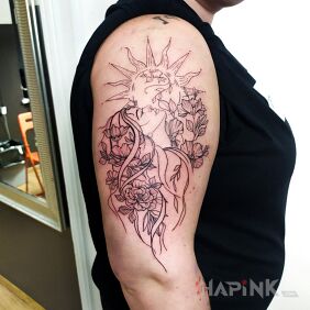 Tattoo Woman and sun on the upper arm motif: flowers style: graphic / illustrative