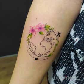 Tattoo Earth globe on the forearm motif: flowers style: graphic / illustrative