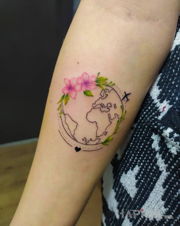 Tattoo Kula ziemska in floral motif and graphic / illustrative style On the arm