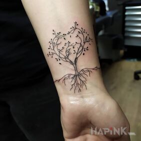 Tattoo Tree with letters on the wrist motif: floral style: graphic / illustrative