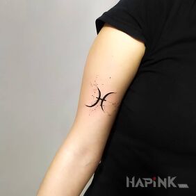 Tattoo Fish on the bicep motif: black and gray style: minimalistic