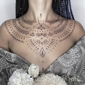 Tattoo Small ornaments under the neck on the chest motif: black and gray style: minimalistic