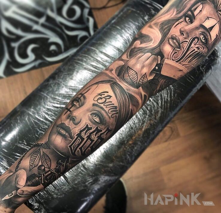 Tattoo Dwie kobiece twarze z tatuażami ? in black and gray motif and realistic style On the arm