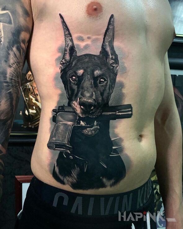 Tattoo Doberman ze spluwą in objects motif and realistic style on the ribs