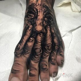 Tattoo Portrait on a Foot on the foot motif: characters