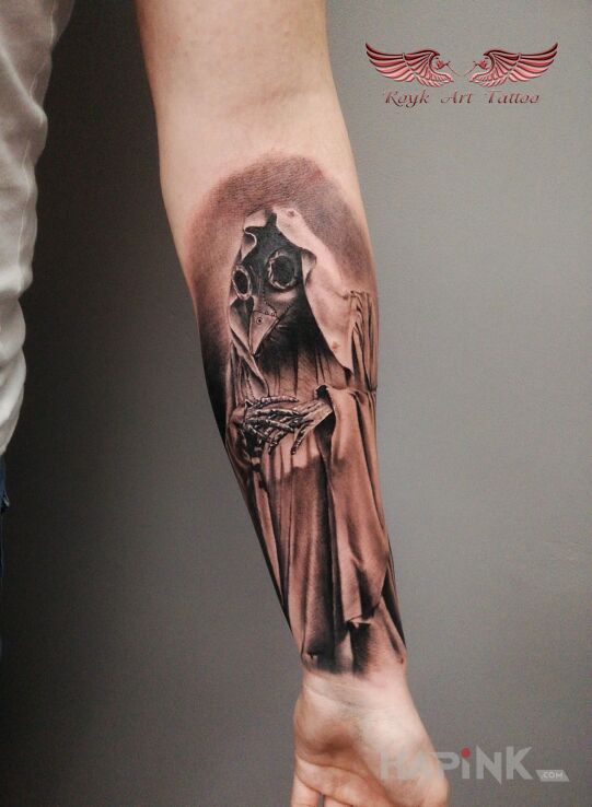 Tattoo Pandemiczny koleszka in black and gray motif and realistic style on the forearm