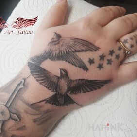 Tattoo Swallows On the arm motif: animals style: realistic