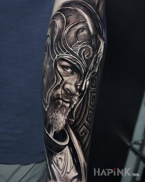 Tattoo Rycerz w helmie in black and gray motif and realistic style on the forearm