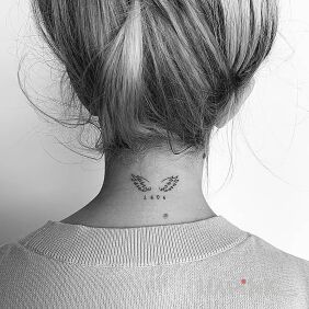 Tattoo 1404 on the nape motif: wings style: minimalistic