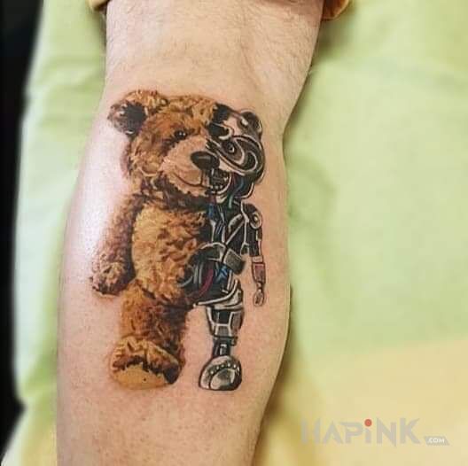 Tattoo Miś ? in objects motif and realistic style on the leg