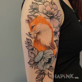 Tattoo Fox on the upper arm motif: flowers style: realistic