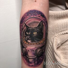 Tattoo Cosmic cat. on the forearm motif: animals style: realistic