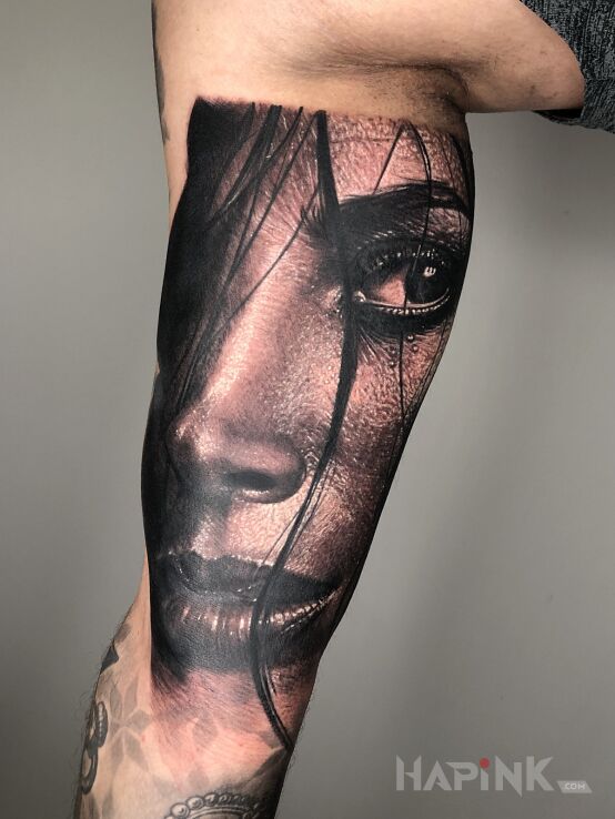 Tattoo Mokra Włoszka ? in faces motif and realistic style on the forearm