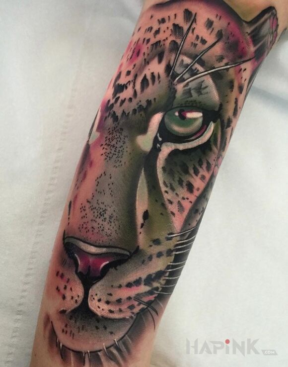 Tattoo Lampart in animals motif and realistic style on the forearm
