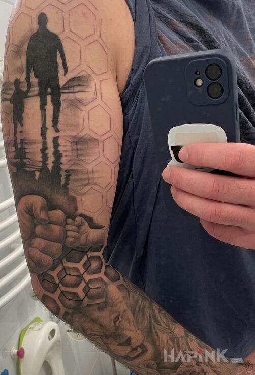 Tattoo W trakcie hexagon … in black and gray motif and geometric style On the arm
