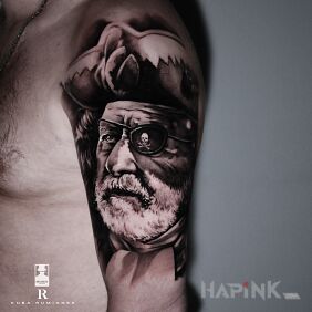 Tattoo Pirate on the upper arm motif: black and gray style: realistic