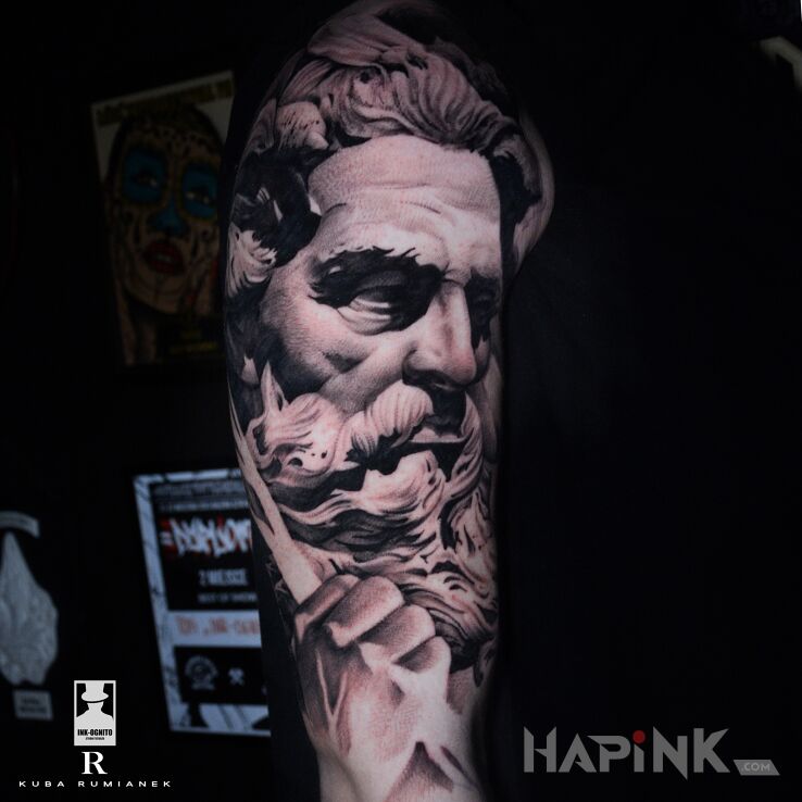 Tattoo Zeus in black and gray motif and realistic style On the arm