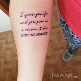 Tattoo Life for live On the arm motif: lettering style: calligraphy
