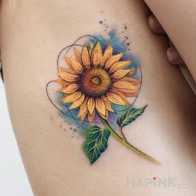 Tattoo Sunflower with a touch of watercolor on the ribs motif: colorful style: realistic